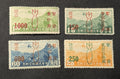 Set of four Unused 1930s Chinese Stamps with Overprint of Bomb Red, Green Orange